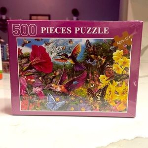 Brand new unopened 500 piece kingfisher garden puzzle.